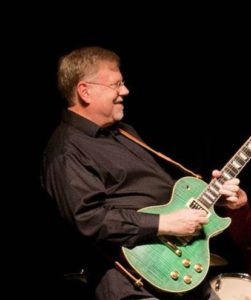 Steve Cass playing electric guitar